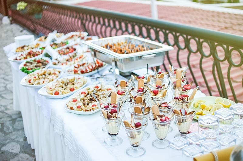 Snacks and desserts served on catering table